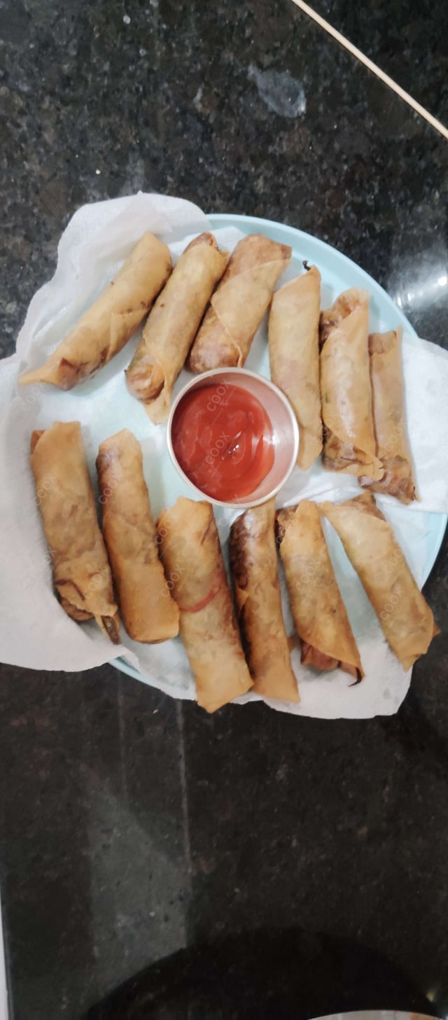 Delicious Veg Spring Rolls prepared by COOX