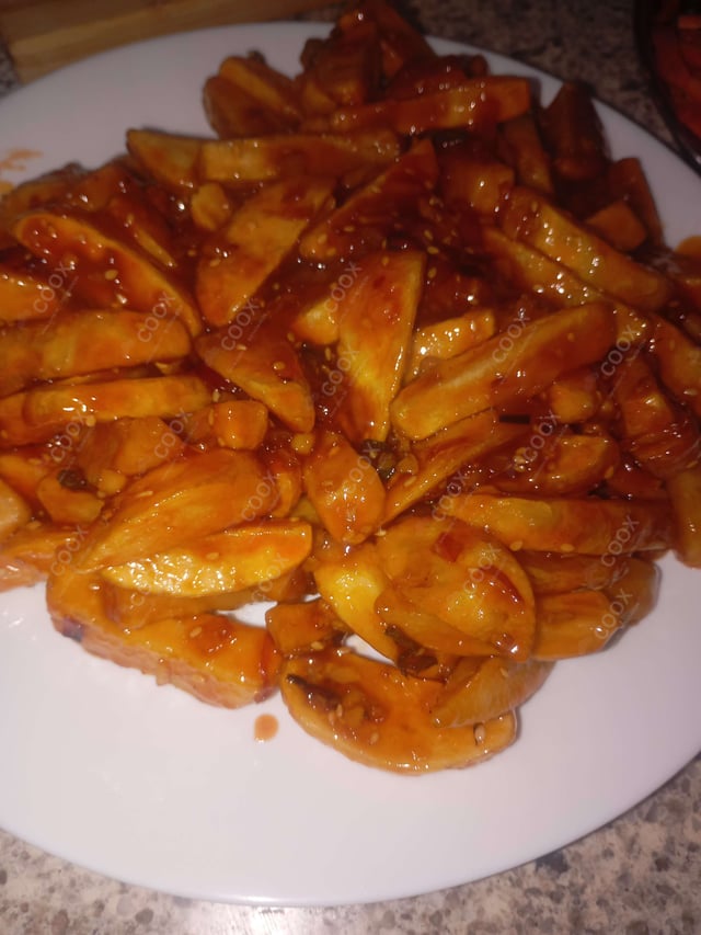 Delicious Honey Chilli Potato prepared by COOX