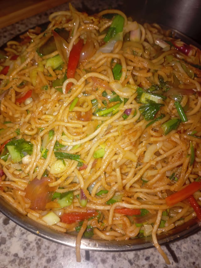 Delicious Veg Hakka Noodles prepared by COOX