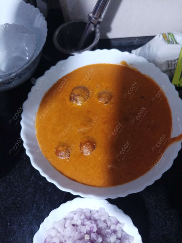 Delicious Malai Kofta (Orange Gravy) prepared by COOX