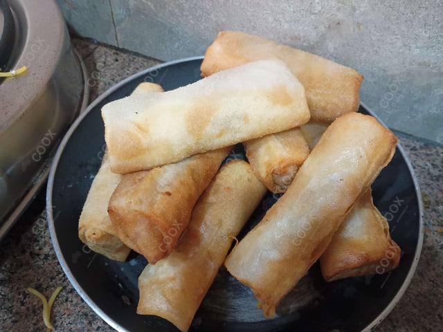 Delicious Veg Spring Rolls prepared by COOX