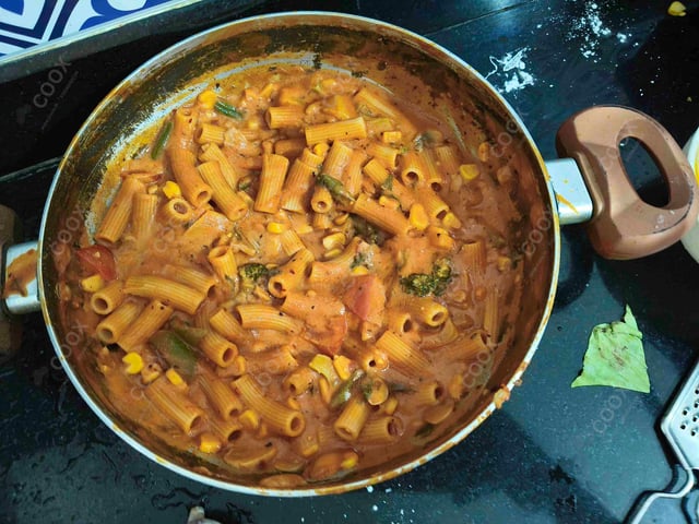 Delicious Ravioli in Pink Sauce prepared by COOX