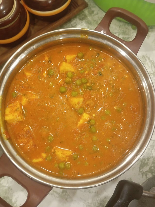 Delicious Matar Paneer prepared by COOX