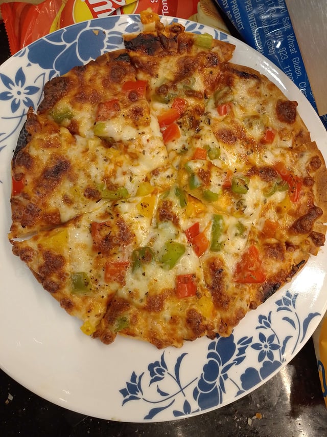 Delicious Veg Pizza prepared by COOX