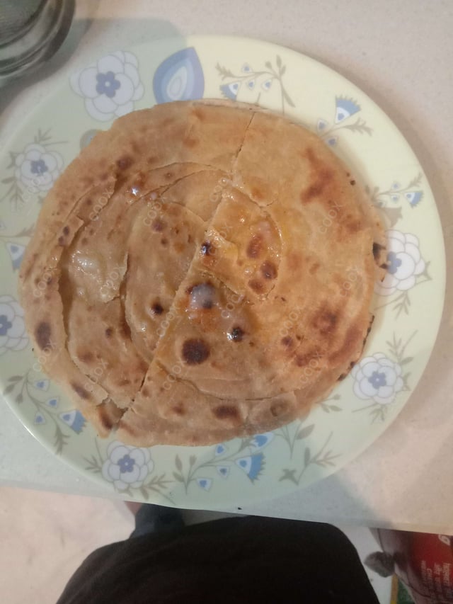 Delicious Lachha Parathas prepared by COOX