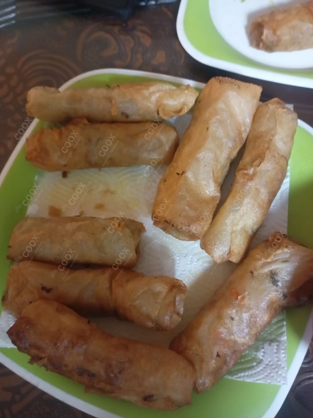 Delicious Veg Spring Rolls prepared by COOX