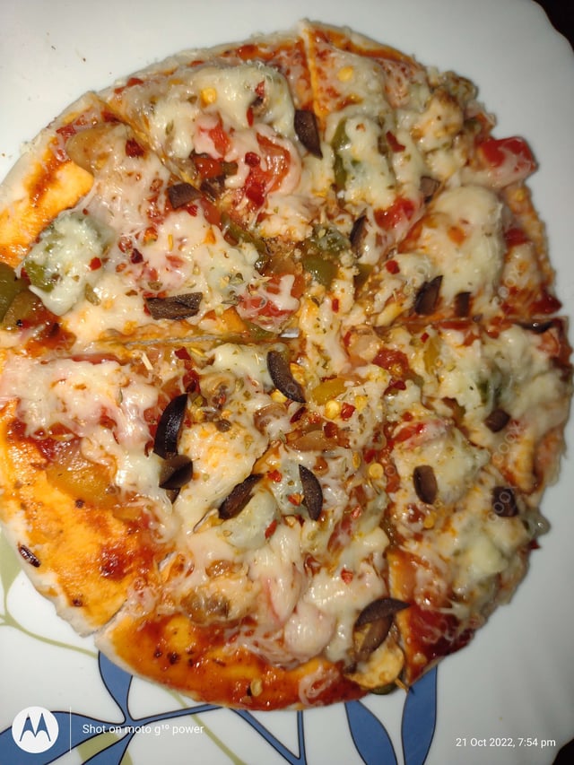 Delicious Veg Pizza prepared by COOX