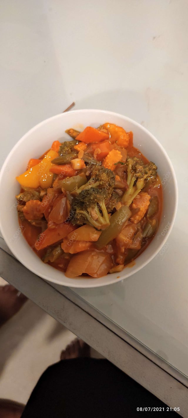 Delicious Mix Veg in Schezwan Sauce prepared by COOX