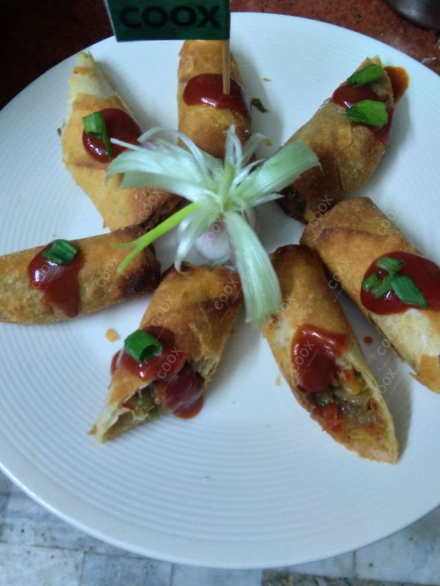 Delicious Veg Spring Rolls prepared by COOX