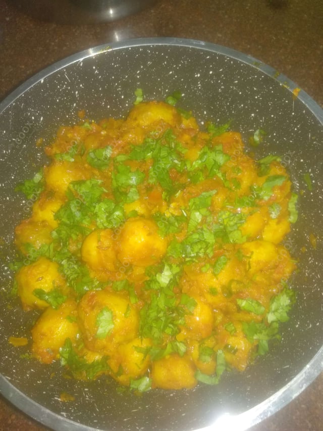 Delicious Dum Aloo prepared by COOX