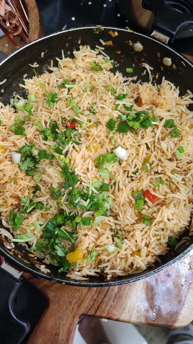 Delicious Schezwan Fried Rice prepared by COOX