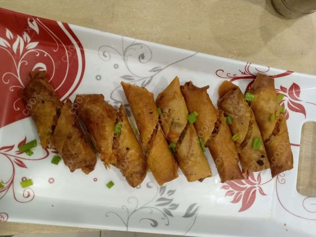 Delicious Veg Spring Rolls prepared by COOX