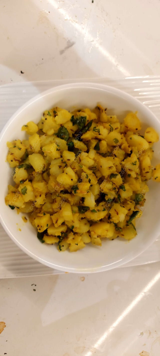 Delicious Jeera Aloo prepared by COOX